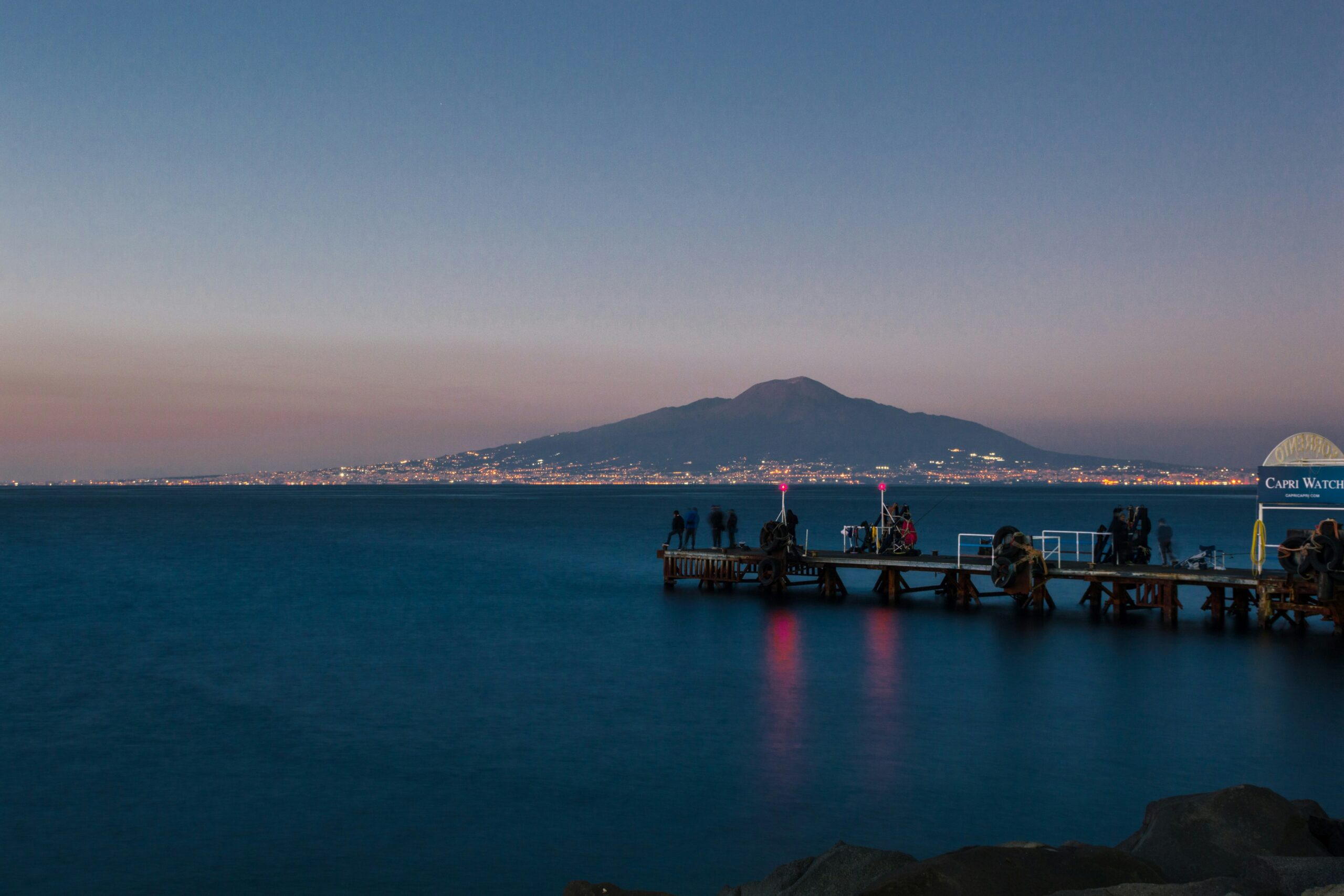 Sunset over the sea with Mount Vesuvius from Sorrento viewpoint